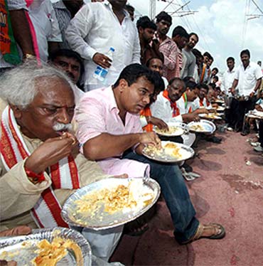 TRS leaders having their meals on the rail tracks during the agitation on Saturday
