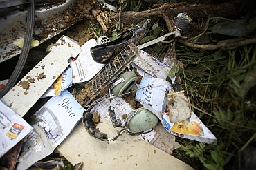 Belongings of victims are seen at the scene of the Buddha Air plane crash in Lalitpur