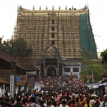 Devotees throng to Sree Padmanabhaswamy temple after offering prayers on the eve of Pongala