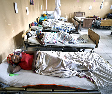 Women who have suffered sustained sexual abuse rest while recovering from fistula repair surgeries in a hospital in Goma, Congo