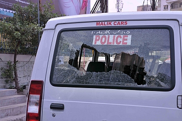 A police vehicle damaged by Telangana supporrters