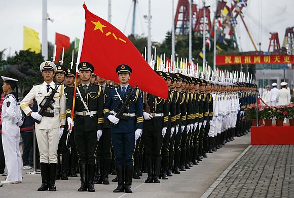 Chinese People's Liberation Army soldiers take part in a parade