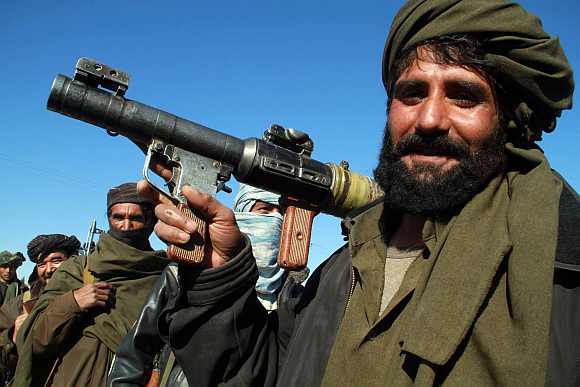 Taliban vigilantes roam on the streets in Afghanistan
