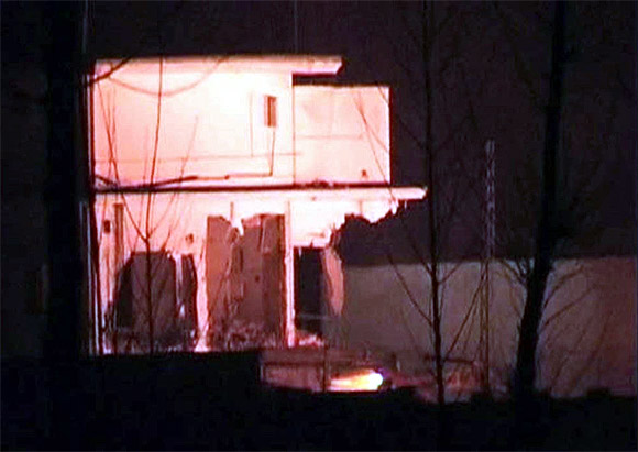 Demolition work is carried out of the building where Aal Qaeda leader Osama bin Laden was killed by US Special Forces