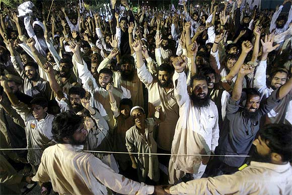 JuD activists shout anti-Indian slogans during a rally in Islamabad