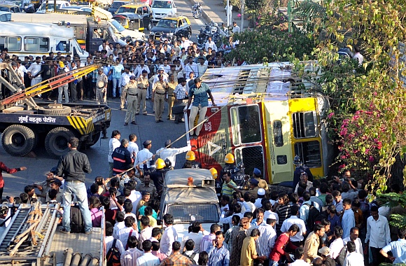 The overturned bus at Mumbai's Kalanagar