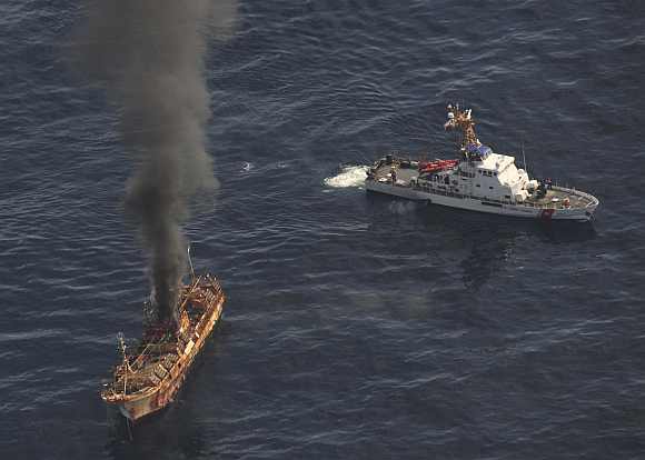 Ryou-Un Maru burns after US coast guard fired explosive ammunition at the vessel
