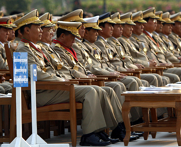 From left to right: Former generals Thura Shwe Man and Thein Sein with other military officers watch a marchpast during the 2010 Armed Forces Day ceremony.