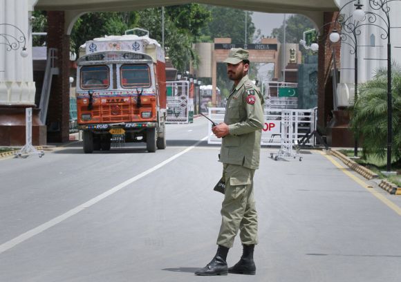 A Pakistani soldier stands guard at the Wagah border separating India and Pakistan