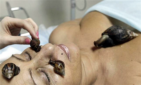 ODD PHOTOS: African snail massage, $3,178 tea and more