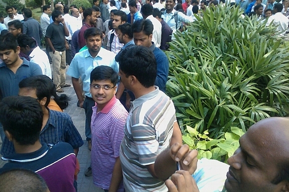 People rushed out of their offices after the tremors, in Chennai