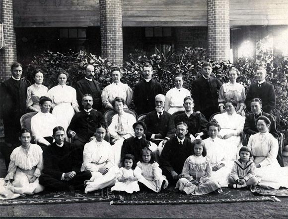 Ruth Becker, sitting, the third child from right, with missionaries in Guntur. Back, her parents Allen Becker, furthest left, and Nellie Becker, third from left