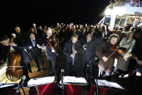 Belgian quintet Grupetto perform during a service of remembrance aboard the Titanic Memorial Cruise