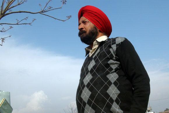 Honorary Captain Bana Singh, Param Vir Chakra, outside his modest village home in Kadyal. Photograph: Rajesh Karkera/Rediff.com