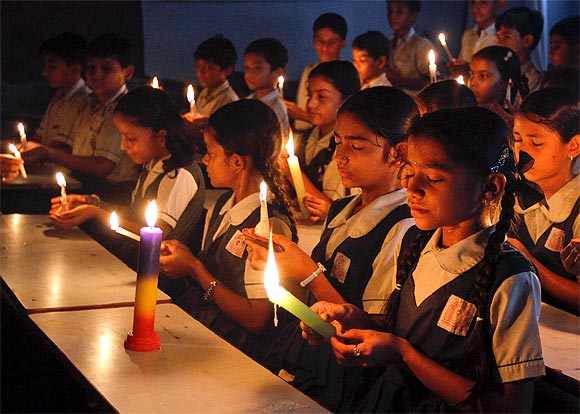Students attend a candlelight prayer ceremony