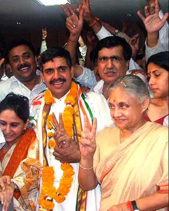 A file photo of Sandeep Dixit (garlanded) with Delhi Chief Minister Sheila Dixit