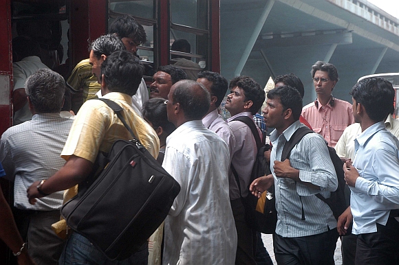 Commuters jostle at the Kurla bus stand