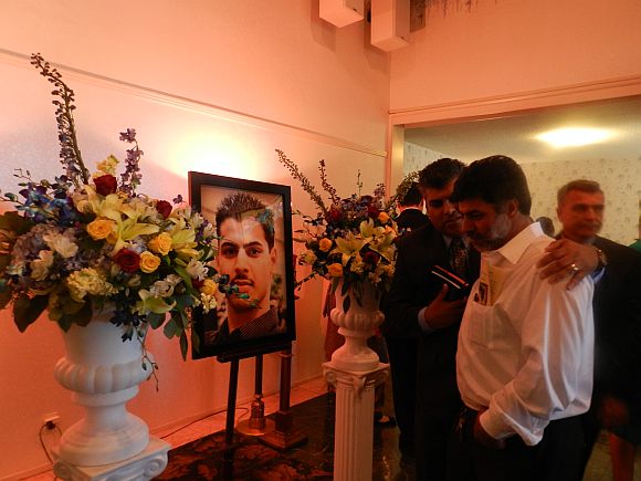 Rahul's father Prannath (in white shirt) at the funeral service