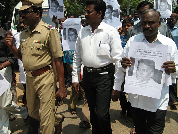 Residents of Tirunelveli gather at the collectorate office with posters of Alex Paul Thomas urging for his early release from Maoist captivation in Chhattisgarh
