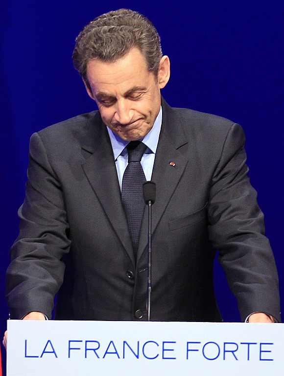 France's President Nicolas Sarkozy speaks to supporters at La Mutualite meeting hall in Paris after early results in the first round vote of the 2012 French presidential election April 22