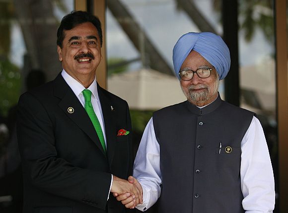 File image of Pakistan PM Gilani shaking hands with PM Singh during the 17th SAARC summit in Maldives