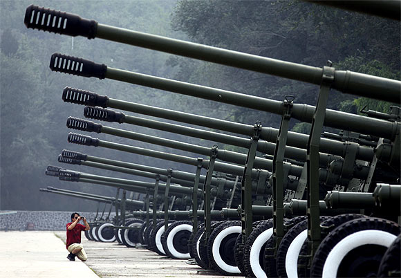 A row of old anti-aircraft guns on display outside Beijing