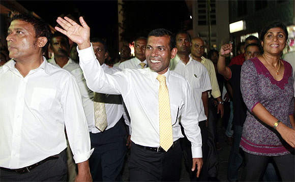 Former Maldives President Mohamed Nasheed waves at his supporters