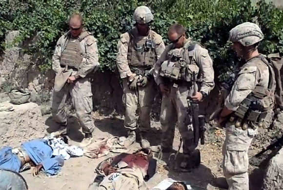 Video grab taken from an undated YouTube video showing what is believed to be US Marines urinating on the bodies of dead Taliban soldiers in Afghanistan
