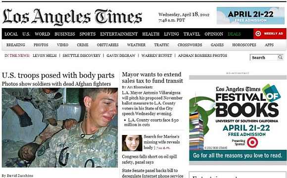 Los Angeles Times published pictures showing soldier from the Army's 82nd Airborne division with the body of a killed Afghan insurgent