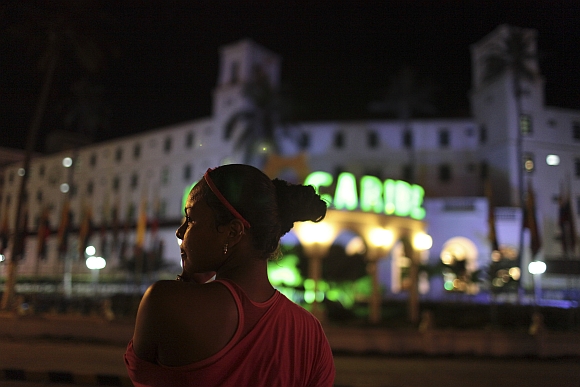 A prostitute stands in front of the Hotel Caribe in Cartagena