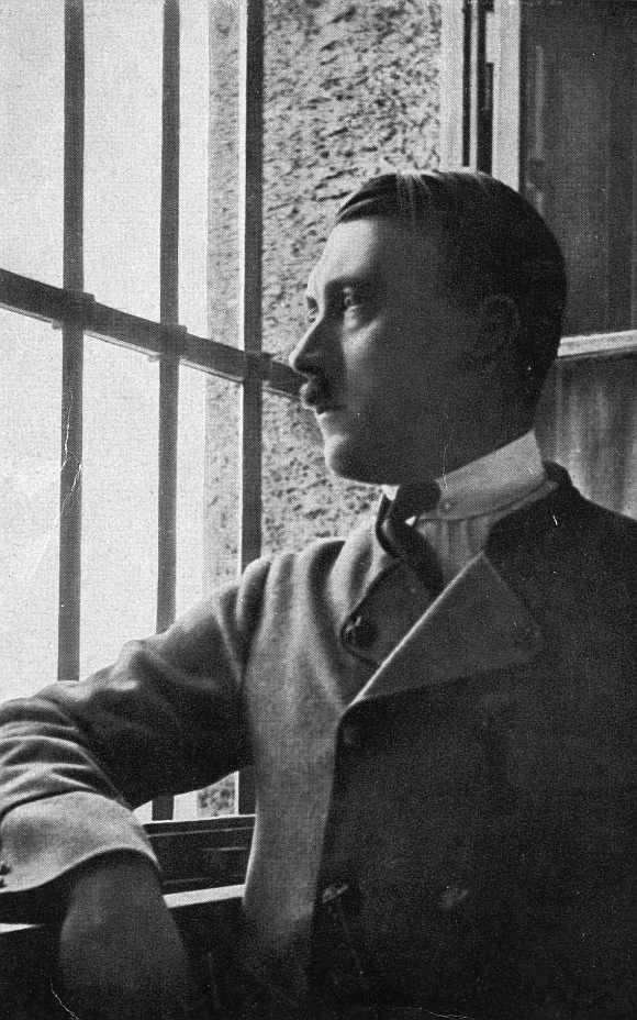 Adolf Hitler looks out of a barred window in Landsberg jail where he dictated his autobiography, Mein Kampf