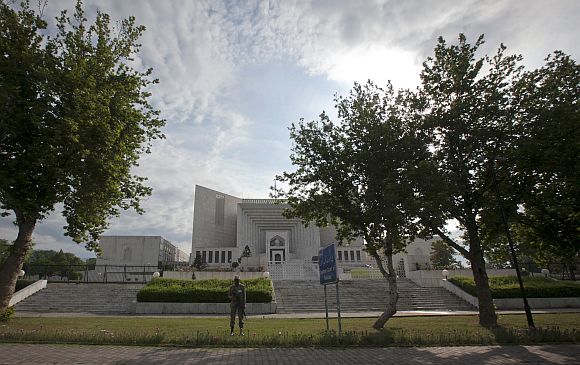 A security official stands guard outside the supreme court in Islamabad on Thursday