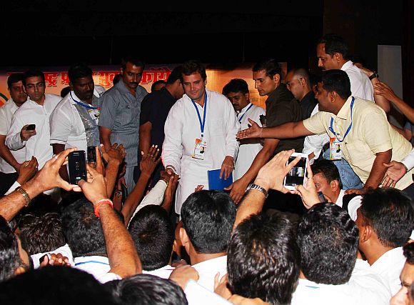Rahul Gandhi shakes hands with young Congress workers during a function in Mumbai on Friday