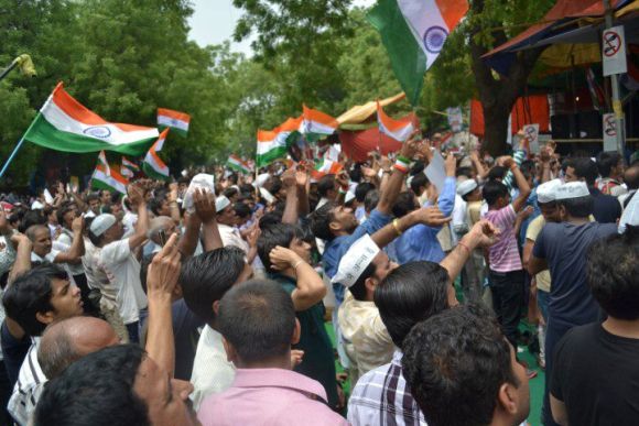 Supporters of Anna Hazare shout slogans at Jantar Mantar in New Delhi