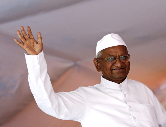Social activist Anna Hazare waves to his supporters during his public hunger strike in New Delhi