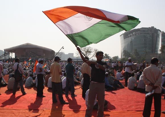 A supporter of Anna Hazare waves the tricolour during his anti-graft fast at BKC Grounds in Mumbai last year