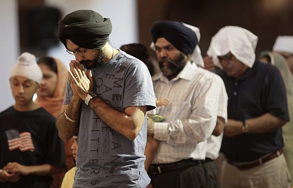 Mourners attend a prayer service at the Sikh Temple in Brookfield, Wisconsin