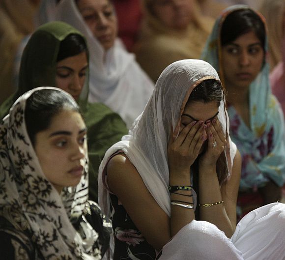 Mourners attend a prayer service at the Sikh Temple in Brookfield, Wisconsin