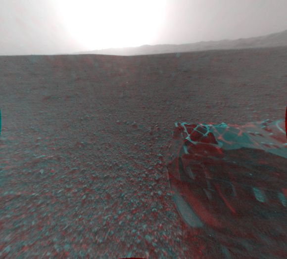 This cropped image is a 3-D view behind NASA's Curiosity rover. The anaglyph was made from a stereo pair of Hazard-Avoidance Cameras on the rear of the rover.