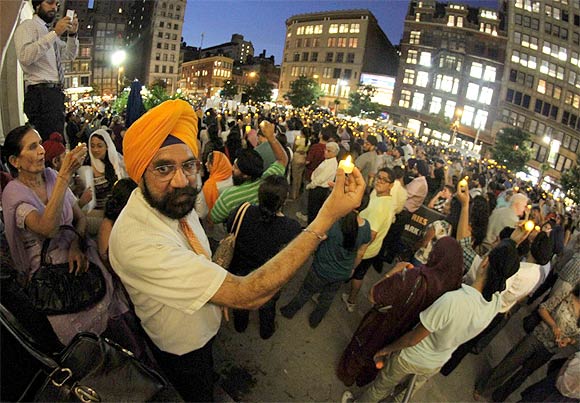 Sikh Americans hold a candlelight vigil to protest the gurdwara shootout in New York city