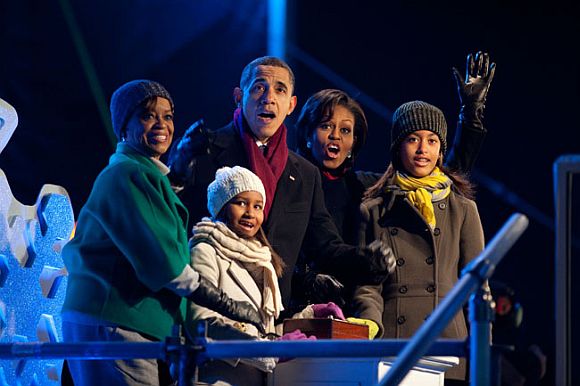 President Barack Obama, with mother-in-law Marian Robinson, daughters Sasha and Malia, and First Lady Michelle Obama