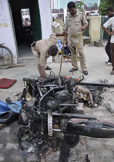 Charred remains of a motorbike set on fire by the mob