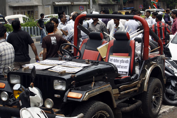 A jeep carrying placards condemning the violence in Mumbai