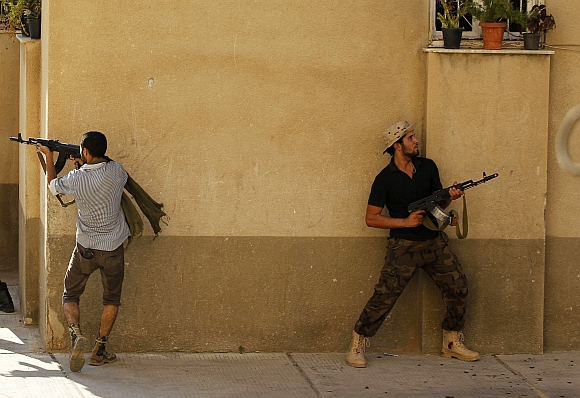 Libyan rebel fighters during the final push to flush out Muammar Gaddafi's forces in Abu Salim district in Tripoli on August 25, 2011