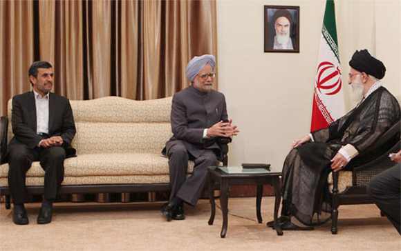 PM chats with Khamenei as Iran President Ahmadinejad looks on