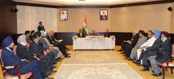 PM, External Affairs Minister S M Krishna and India envoy to Iran D P Srivastava interact with the Indian community in Tehran