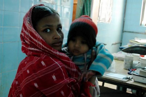 A mother is seen with her child at the Malda Hospital