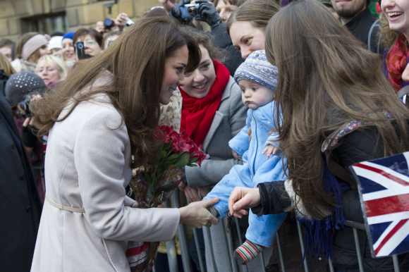 Catherine, Duchess of Cambridge meets 5 month-old James William Davies, who was named after Prince William in Cambridge