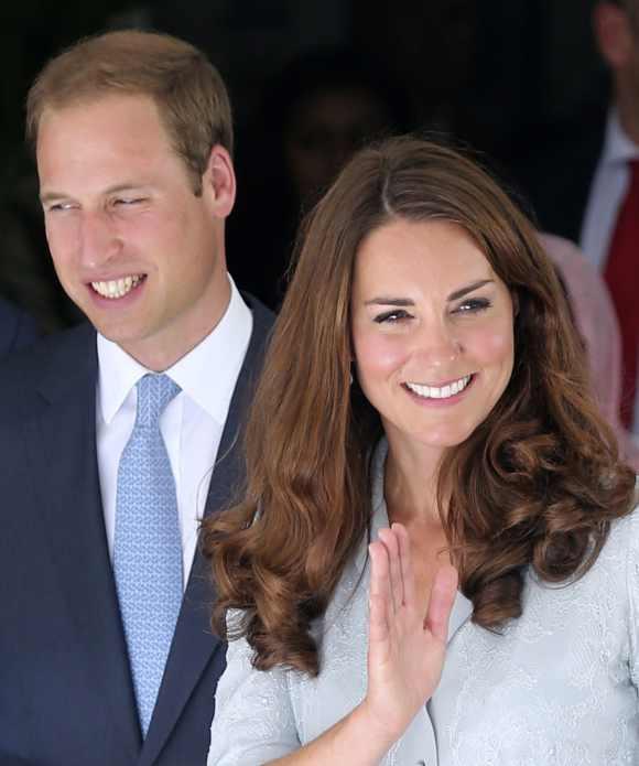 Britain's Prince William and Catherine, Duchess of Cambridge, wave to staff at a Malaysia hospital