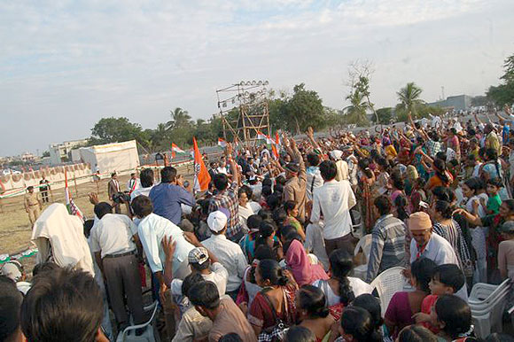 Supporters cheer during Sonia Gandhi's rally in Keshod
